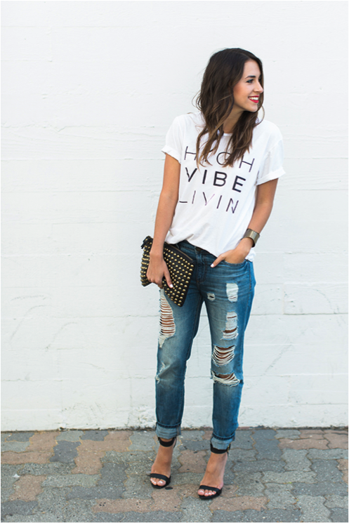 how to wear a graphic tee. graphic tee paired with distressed jeans and heels