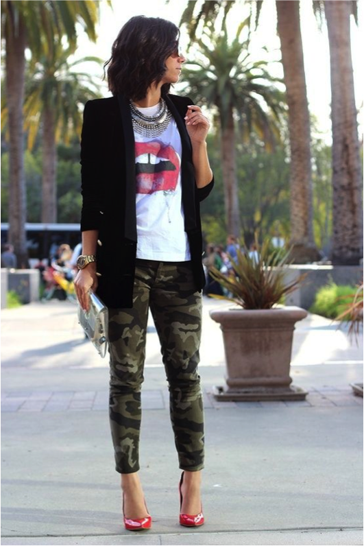 how to wear a graphic tee. graphic tee paired with camo pants, red heels and a blazer