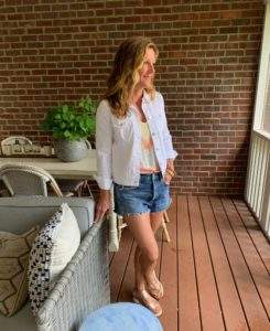 Styling a White Denim Jacket with Distressed Denim Shorts
