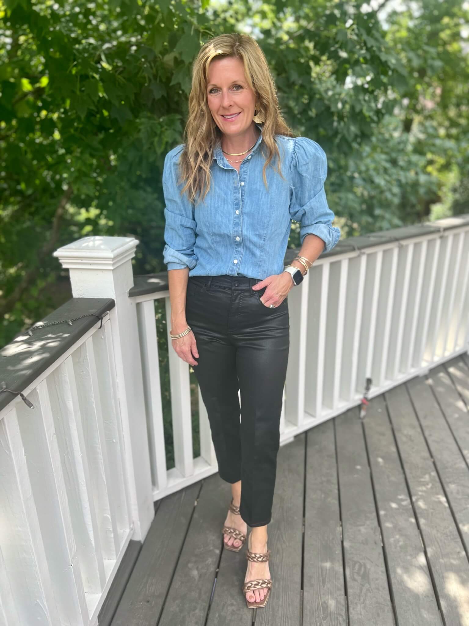 puff sleeve denim shirt and coated straight leg jeans how to wear a denim shirt with black jeans updated version of a denim shirt how to wear puff sleeves versatile metallic heels for fall