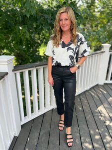 printed short sleeve blouse and coated jeans how to style faux leather in your 40s how to wear faux leather how to style the faux leather trend how to dress up jeans how to wear coated jeans for a girls night out how to style coated jeans for dinner out