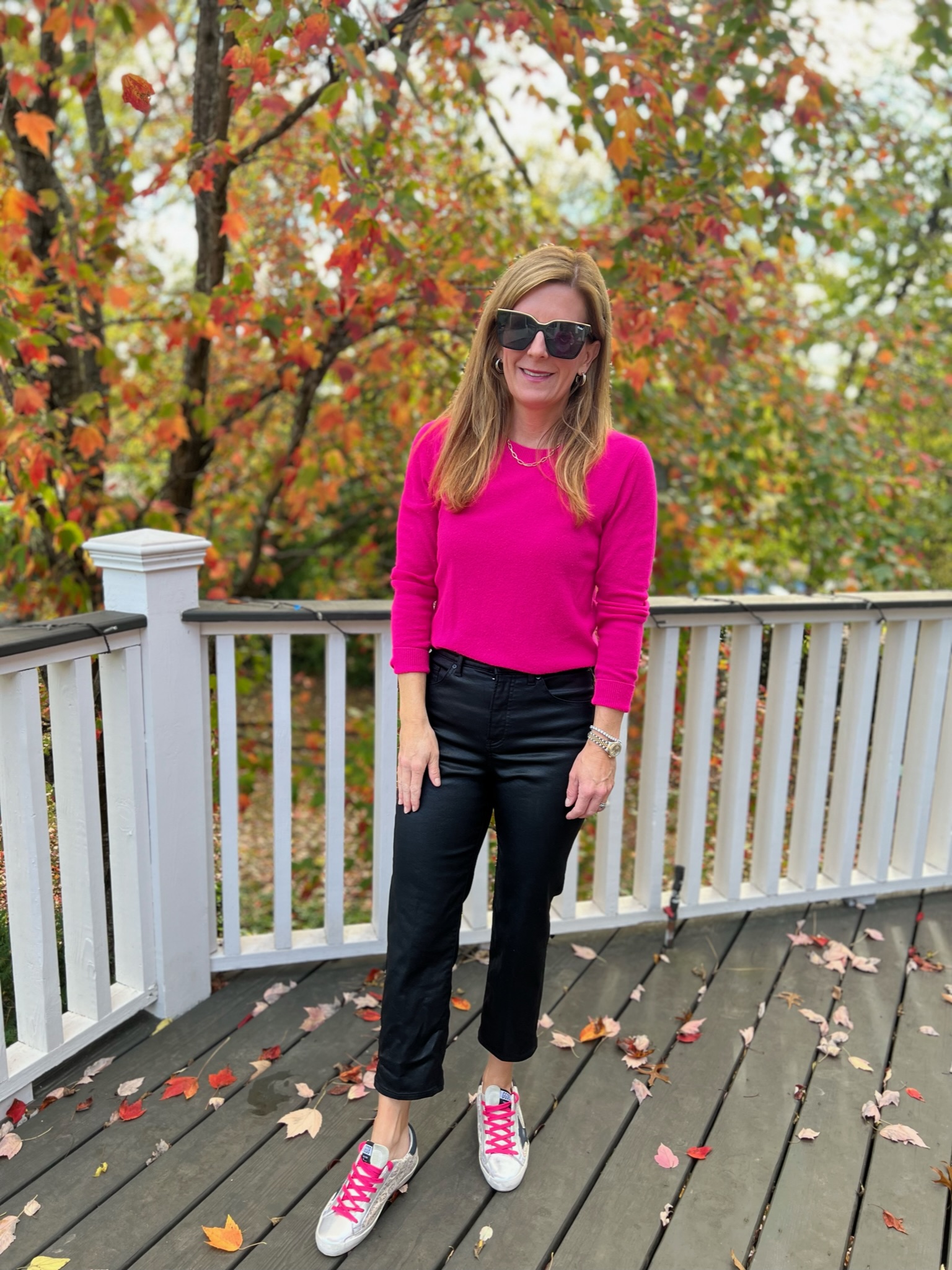 coated jeans and sneakers how to wear hot pink this fall how to style hot pink for fall how to wear sneakers with jeans