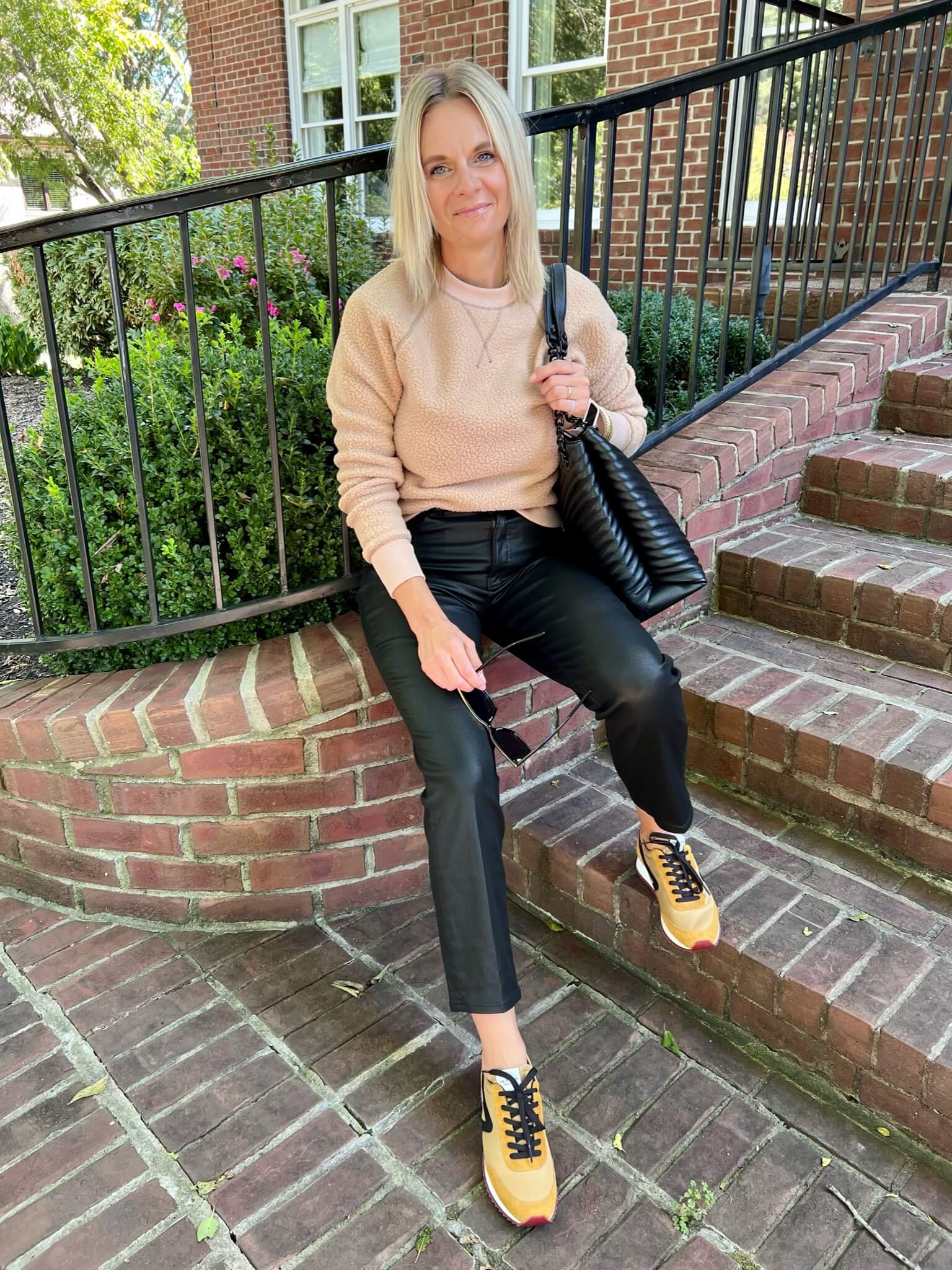 Three Ways To Wear Leather Pants sweatshirt and faux leather jeans how to wear a sweatshirt with coated jeans how to wear sneakers with coated jeans