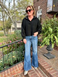 3 Pairs Of Jeans You Need This Season black sweater and flare jeans how to wear flare jeans when you are petite how to style flare jeans with a sweater nashville stylists share favorite flare jeans