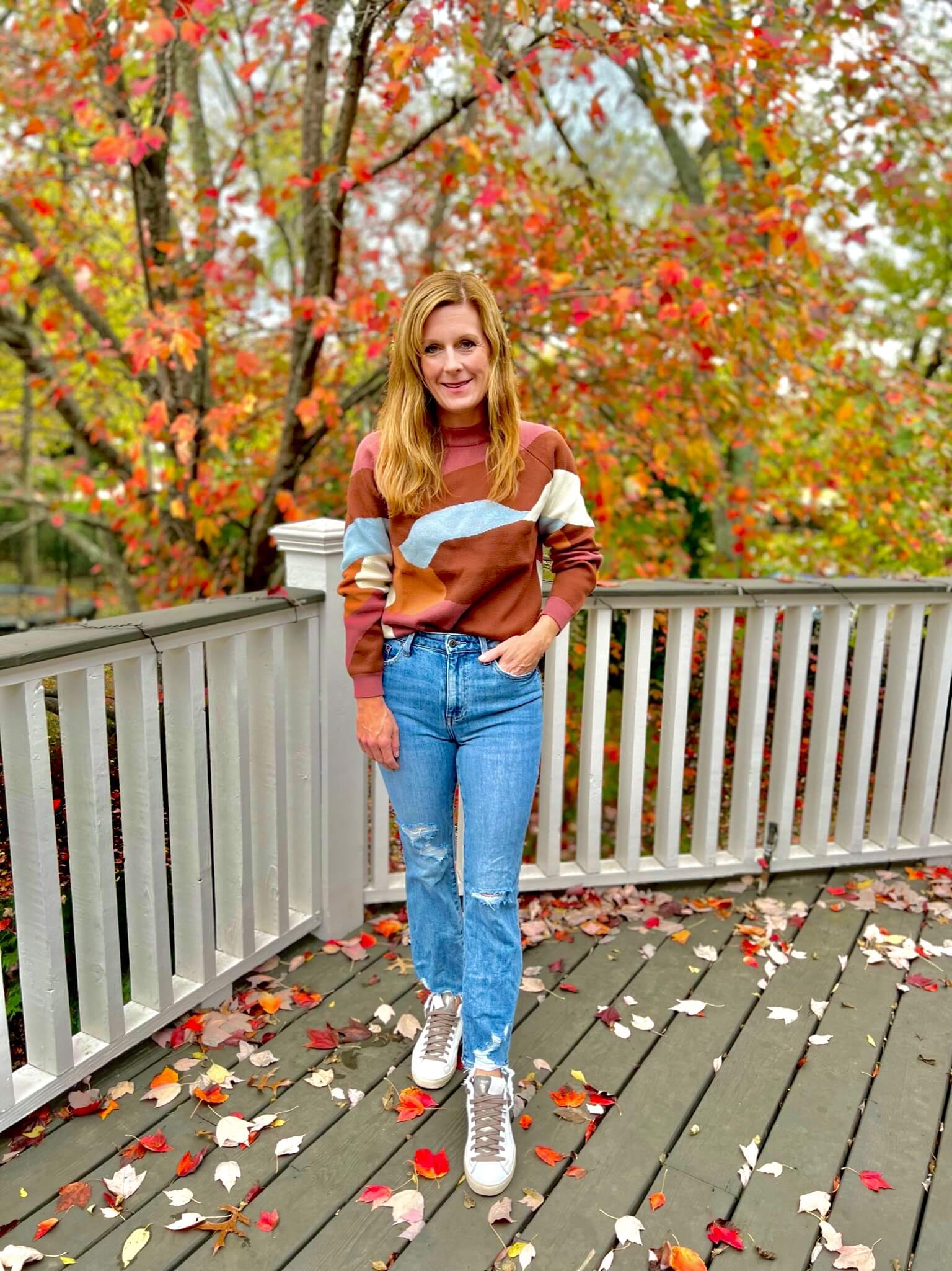 sweater and distressed jeans and sneakers how to wear distressed jeans with a dressy sweater how to wear a fall sweater beautiful fall sweater high quality fall sweater how to wear sneakers with jeans how to wear sneakers with straight leg jeans what to wear to the pumpkin patch what to wear to a fall festival