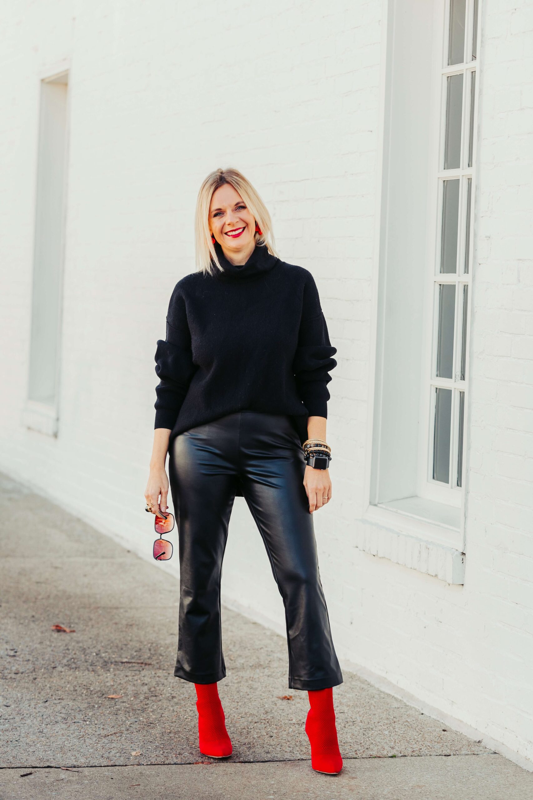 How To Accessorize Your All Black Look This Holiday Season Red Accessories how to accessorize with red for the holidays how to use jewelry to make your all black look festive how to style red booties how to wear all black with red shoes