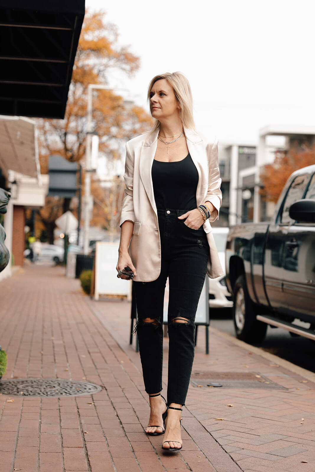 satin blazer & black jeans how to style a satin blazer how to wear a colored blazer over all black personal stylists share Christmas party style inspiration nashville stylists share Christmas party looks how to wear a satin blazer for a party how to style a satin blazer for a party