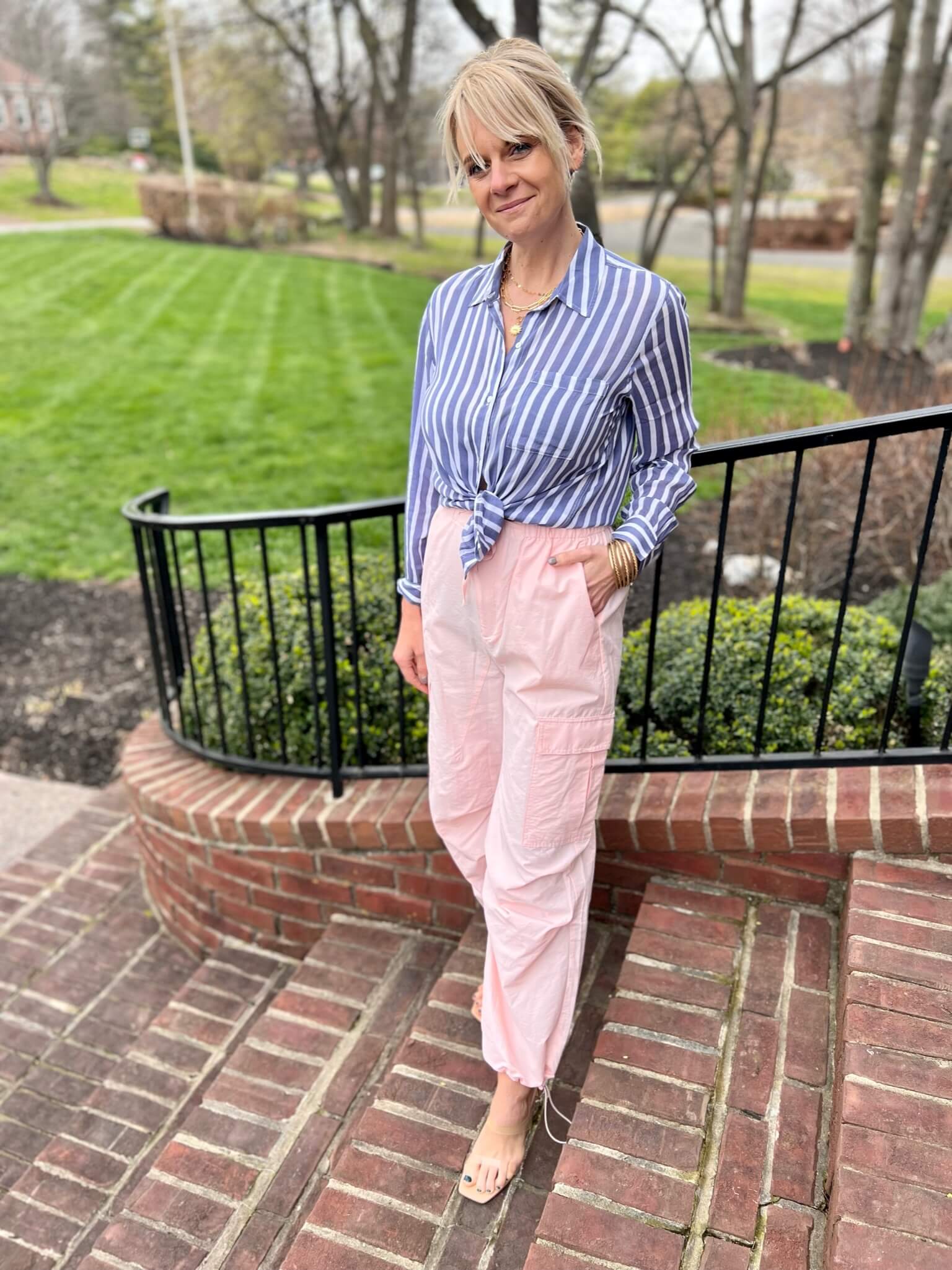 Striped Blue Button-Up Shirt & Cargo Pants creative ways to wear pink and blue together styling pink and blue adding pattern to a two toned outfit style inspiration for your cargo pants styling tips for your cargo pants