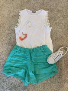 White Tank & Turquoise Shorts style inspiration for shorts personal stylists share ideas on styling your shorts