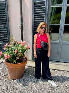 How To Pack For A European Vacation Pink Halter Tank & Black Palazzo Pants how to wear white tennis shoes with black pants how to style white tennis shoes how to style palazzo pants for summer the best bag for traveling this summer