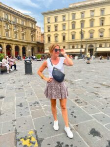 How To Pack For A European Vacation Elevated White Tank & Patterned Skirt how to wear a short skirt in your 40s how to style a skirt with sneakers how to wear tennis shoes with a skirt how to style a patterned skirt how to wear a skirt for travel