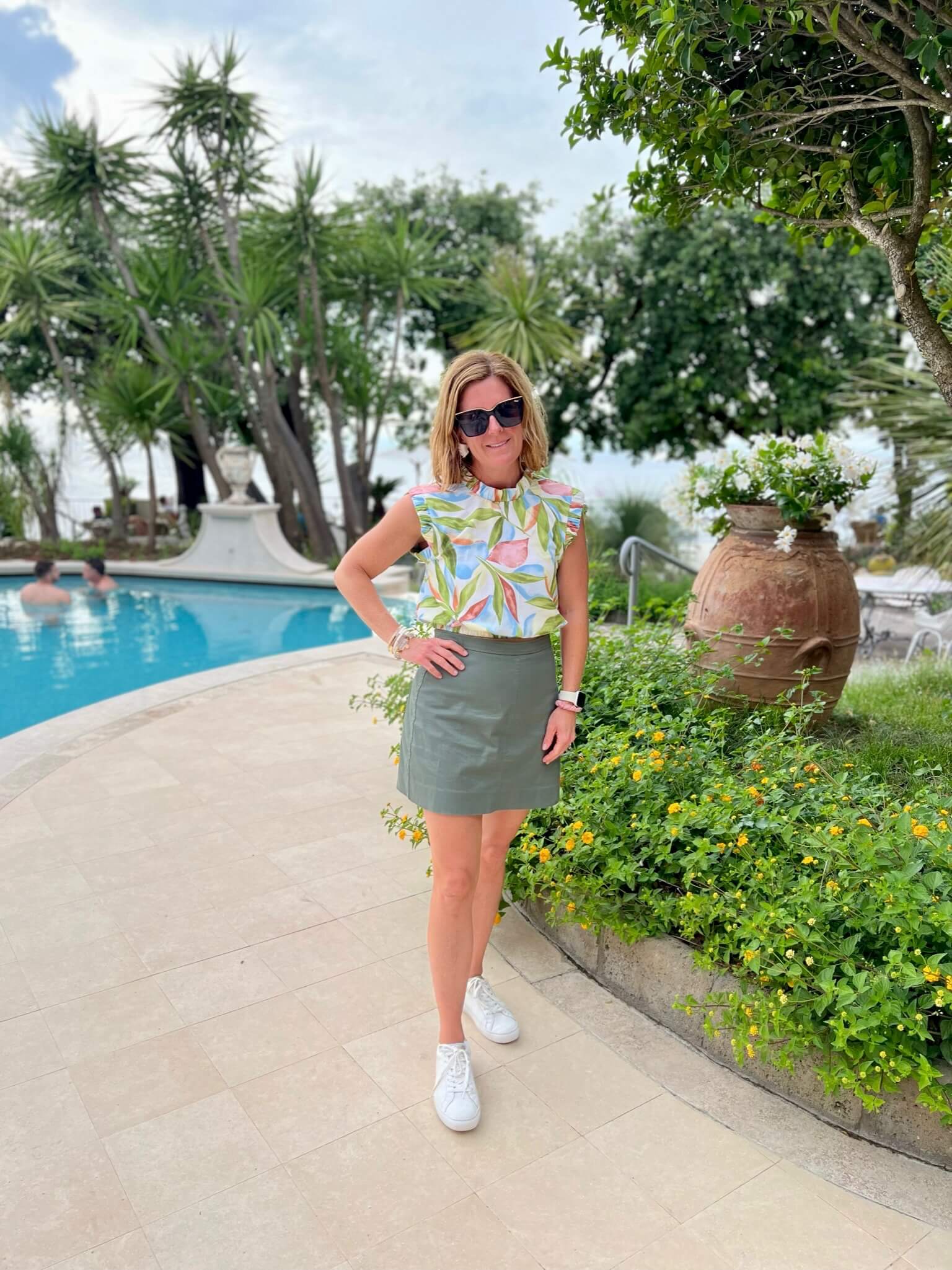How To Pack For A European Vacation Floral Dressy Tank Blouse & Olive Cargo Skirt personal stylists share style inspiration for summer personal stylists share fun summer looks how to style a cargo skirt how to wear sneakers with a skirt how to wear sneakers with a dressy casual look