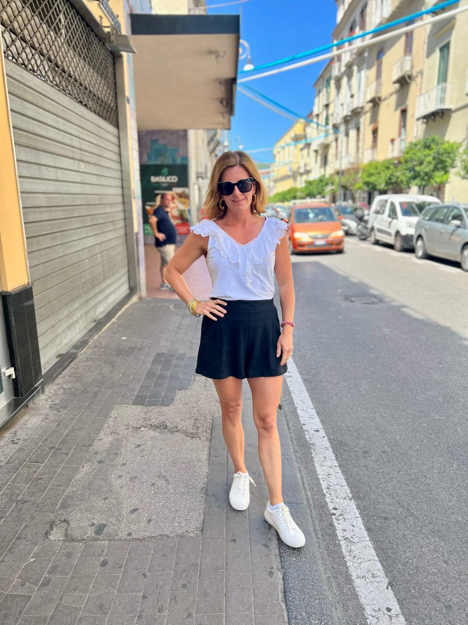 How To Pack For A European Vacation Elevated White Tank & Black Shorts how to wear black and white for summer how to style black shorts how to wear shorts in your 40s the best accessories for your summer travels what to wear in Europe how to dress for traveling in Europe
