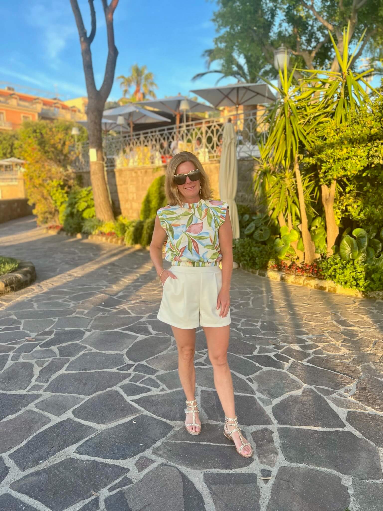 Floral Dressy Tank Blouse & Ivory Faux Leather Shorts styling faux leather in summer what to wear to dinner this summer styling shorts for a nice dinner out