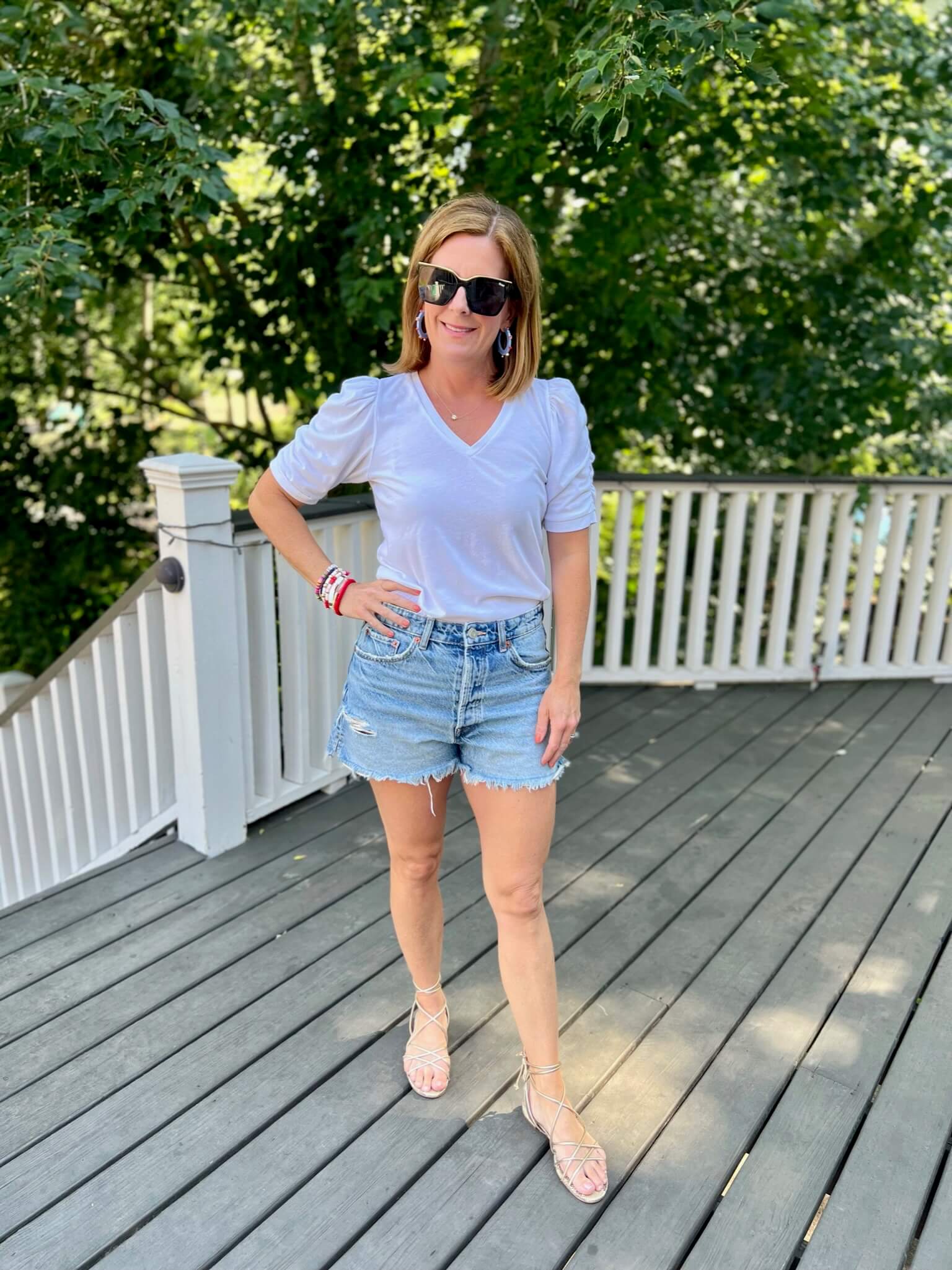 How To Look Festive For July 4th White Tee Shirt & Jean Shorts how to wear jean shorts in your 40s how to style jean shorts for summer how to add color to your look with accessories how to accessorize for the fourth