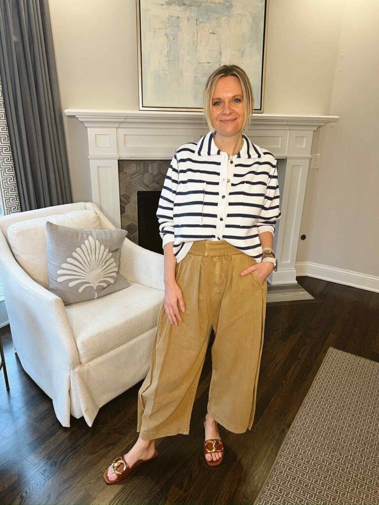 15 Outfits For Early Spring Striped Button-Up Sweater & Wide Leg Pants how to style pleated pants this spring how to wear pleated pants casual spring style spring style inspiration must have pieces for spring pleated pant trend