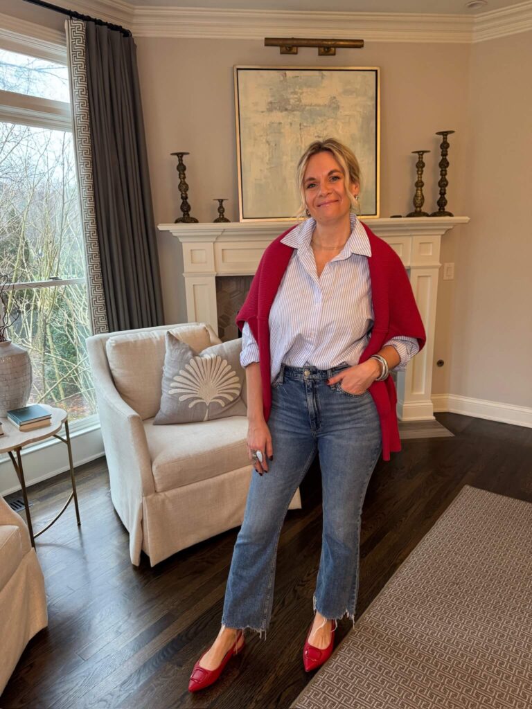 The Difference Between Wearing And Styling Button-Up Shirt & Jeans how to drape a sweater on your shoulders how to style red flats how to style a striped button-up shirt how to wear jeans