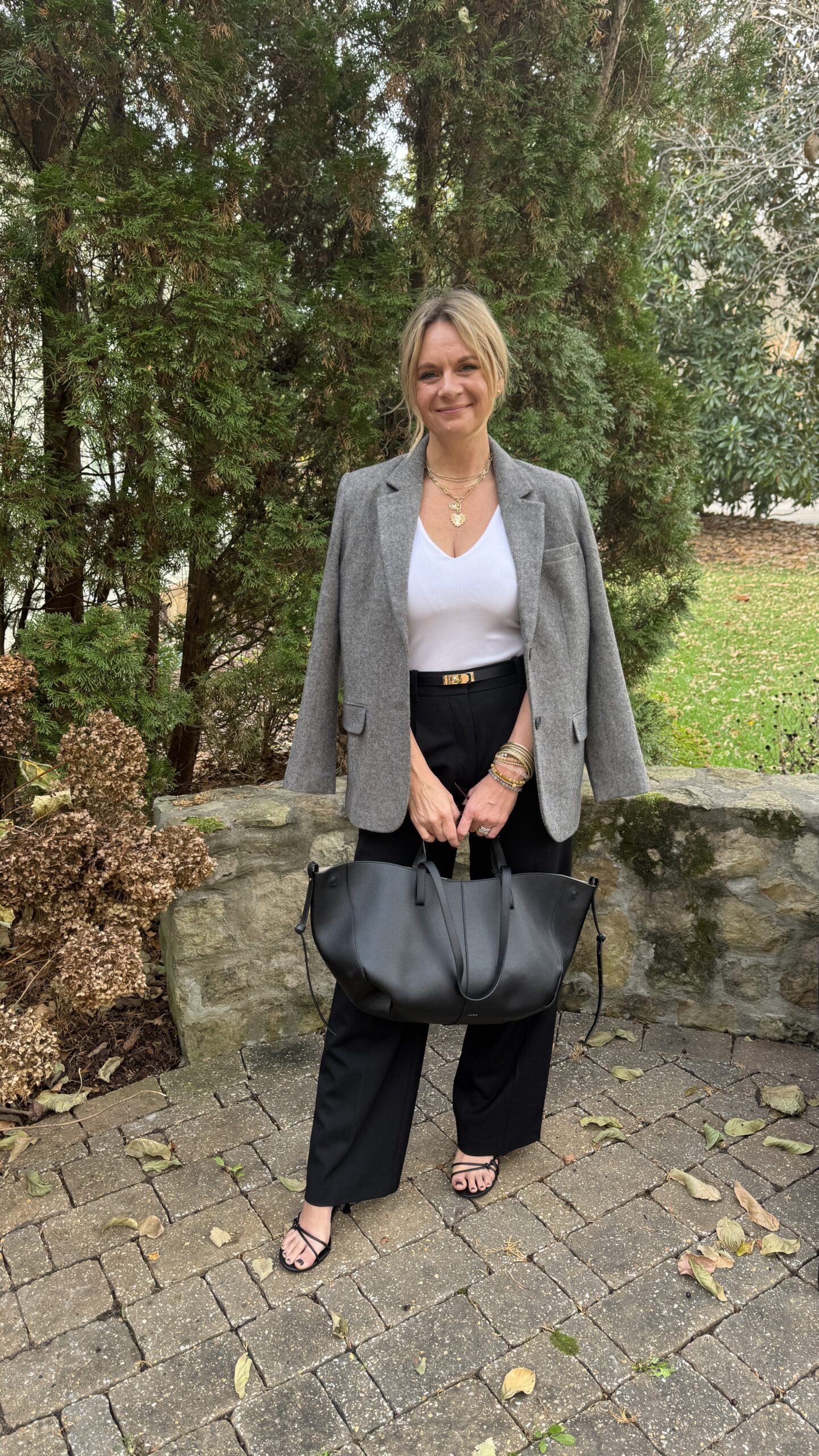 How to Style a Blazer for Work or Client Meetings | A tailored blazer layered over a simple cami and black trousers creates a clean, elevated foundation