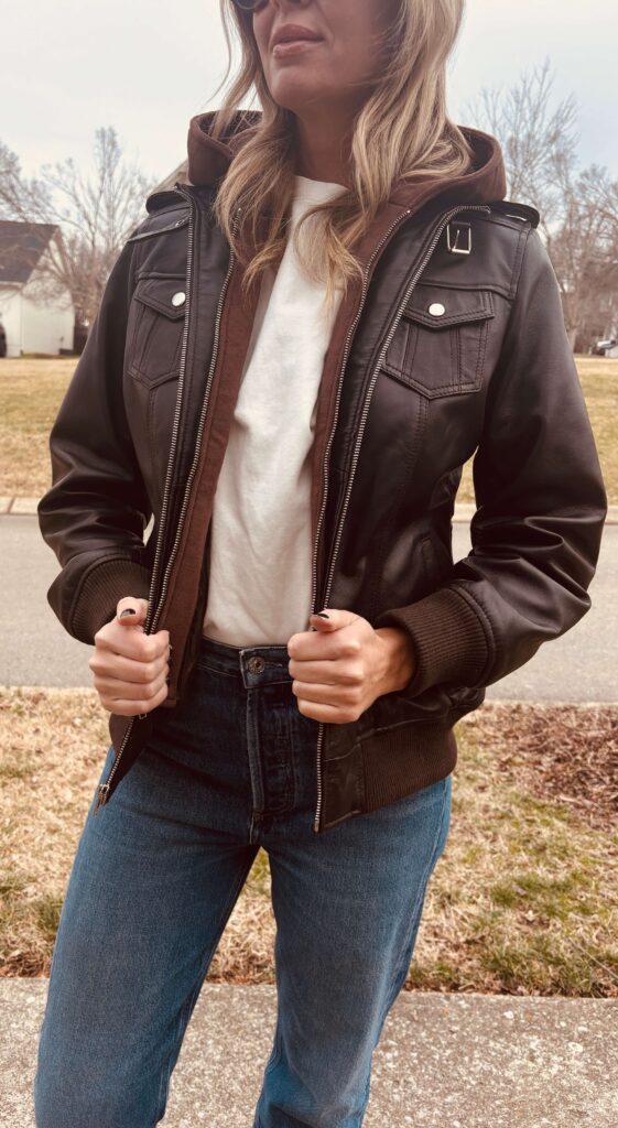 How to Style a Brown Leather Jacket (+ Why Brown Works with Everything) | Brown leather jacket styled with a white tee, straight-leg jeans, brown loafers, and sunglasses for an effortlessly polished vibe. 